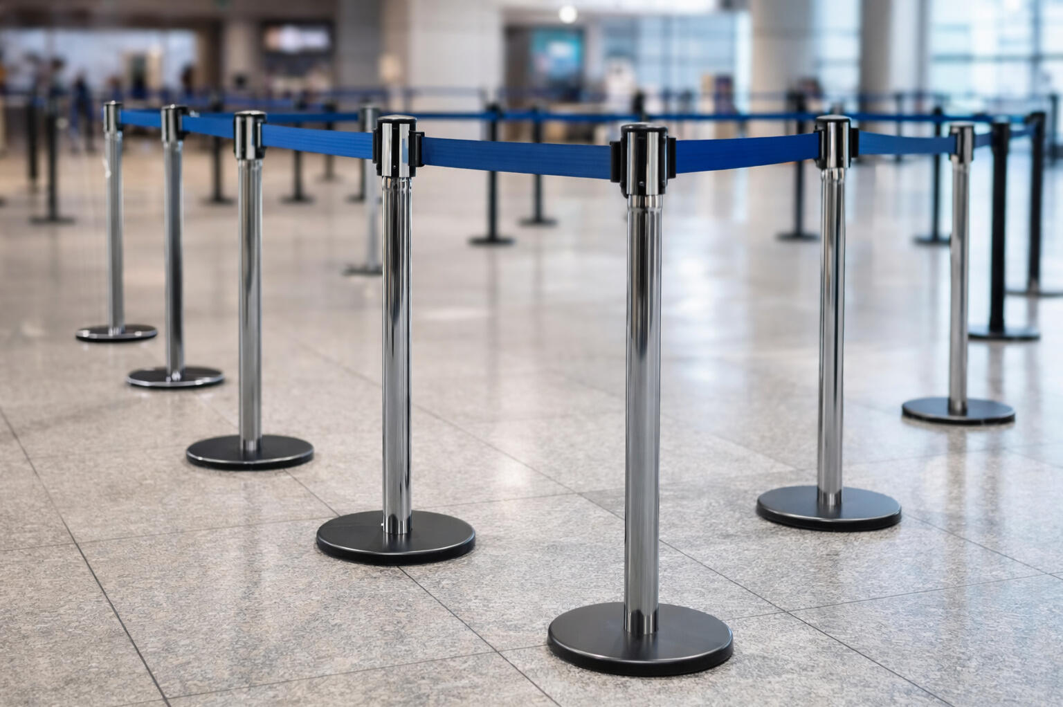 Retractable belt crowd control barriers for queue and line management Retractable belt crowd control barriers for queue and line management