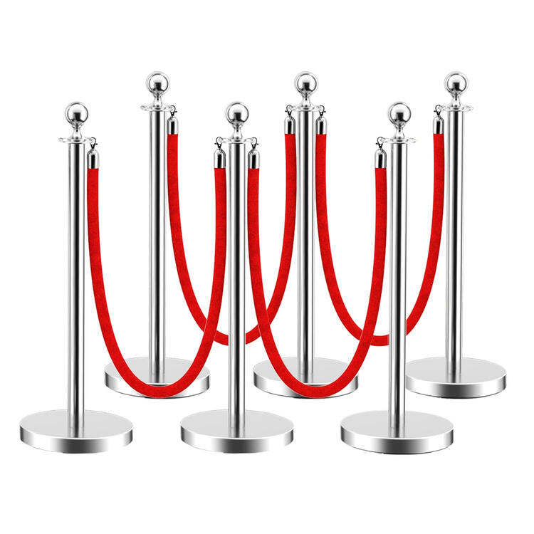 Silver stanchion posts with red velvet rope barrier Silver stanchion posts with red velvet rope barrier