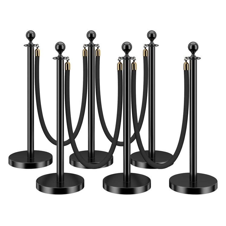 Black velvet rope stanchion barrier with gold posts Black velvet rope stanchion barrier with gold posts